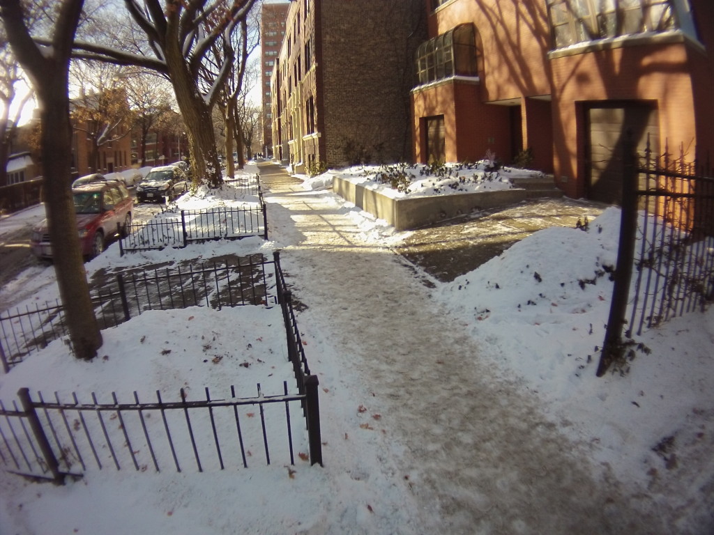 Snow has been cleared on the driveway here, but not the sidewalk.  The snow seems to have been packed down before shovelling occured.