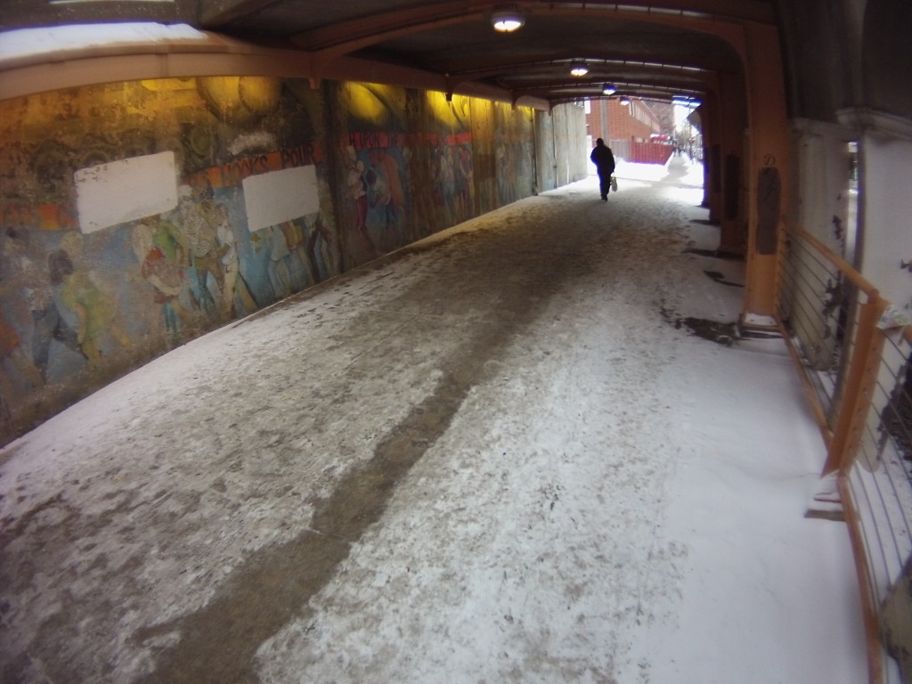 A path has been trampled through the blown snow along 55th St. under the Metra Electric.